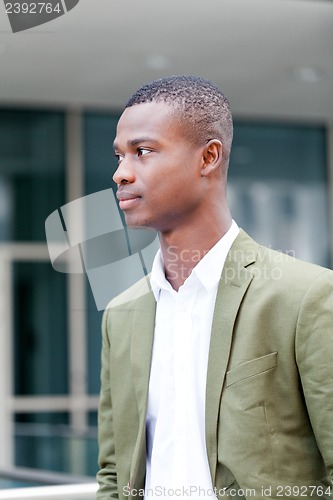 Image of young successful african business man outdoor in summer