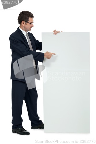 Image of mature smiling businessman holding billboard copyspace isolated