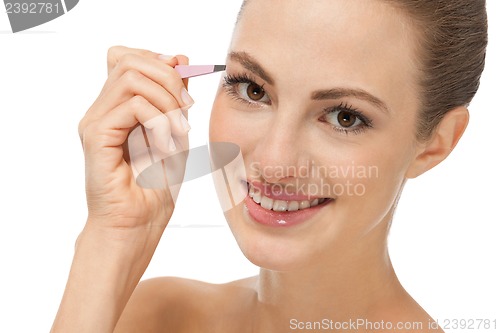 Image of beautiful young woman and eyebrow tweezers 