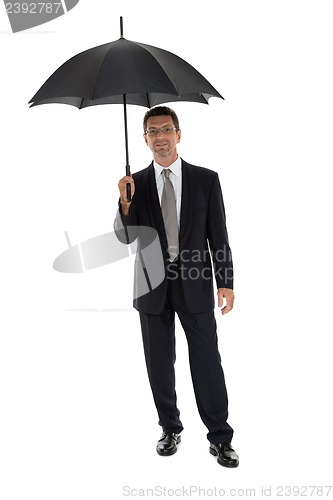 Image of mature attractive business man with umbrella isolated