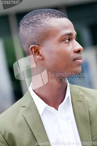 Image of young successful african business man outdoor in summer