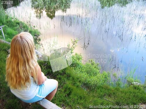 Image of Small girl by lake