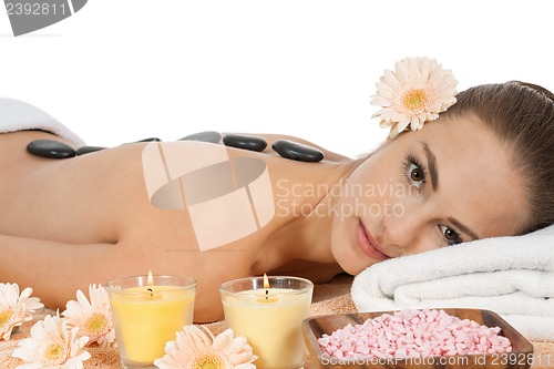 Image of attractive helathy caucasian woman hot stone massage wellness 