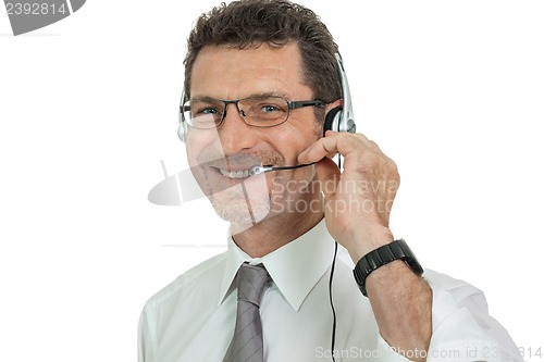Image of smiling mature male operator businessman with headset call senter