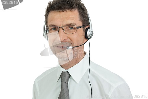 Image of smiling mature male operator businessman with headset call senter