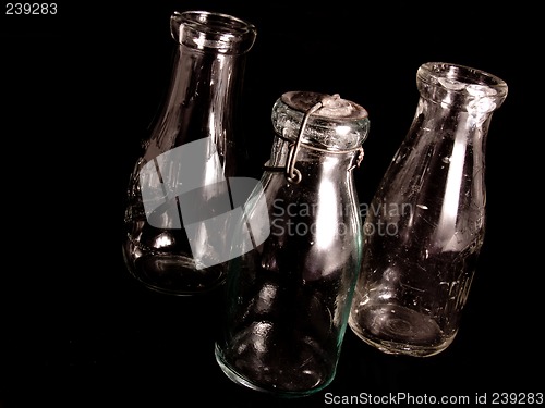 Image of Three Antique Milk Bottles