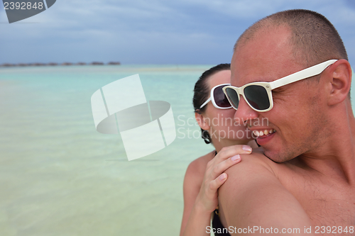 Image of happy young couple have fun on summer