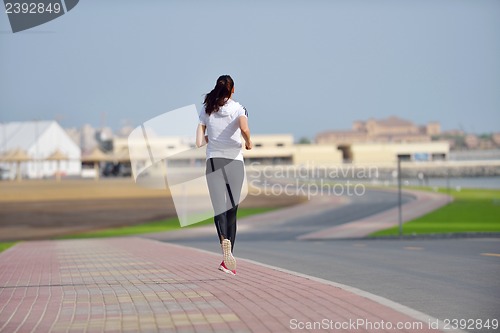 Image of woman jogging at morning