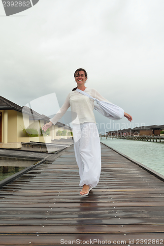 Image of young woman relax on cloudy summer day