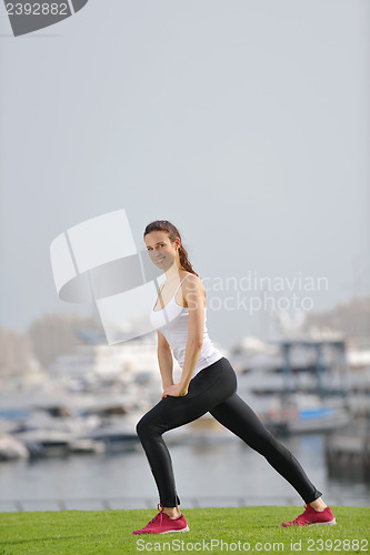 Image of Young beautiful  woman jogging  on morning