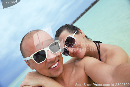 Image of happy young couple have fun on summer