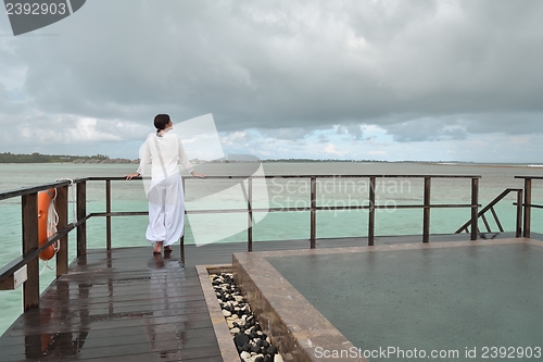 Image of young woman relax on cloudy summer day