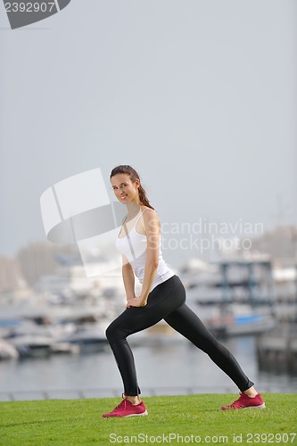 Image of Young beautiful  woman jogging  on morning