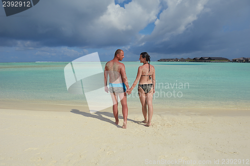 Image of happy young couple have fun on summer