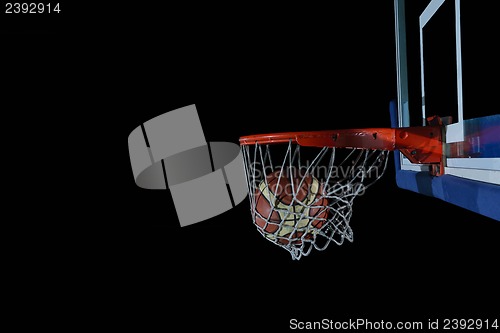 Image of basketball ball and net on black background