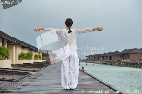 Image of young woman relax on cloudy summer day