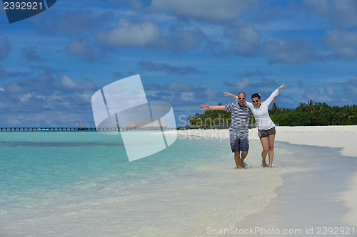 Image of happy young couple have fun on summer