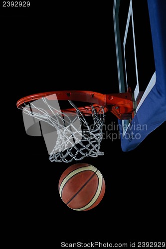 Image of basketball ball and net on black background