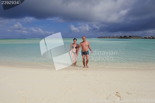 Image of happy young couple have fun on summer