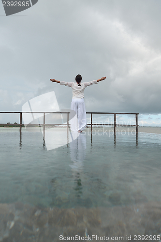 Image of young woman relax on cloudy summer day