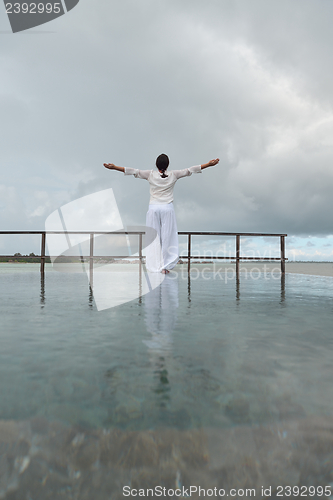 Image of young woman relax on cloudy summer day