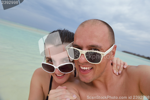 Image of happy young couple have fun on summer