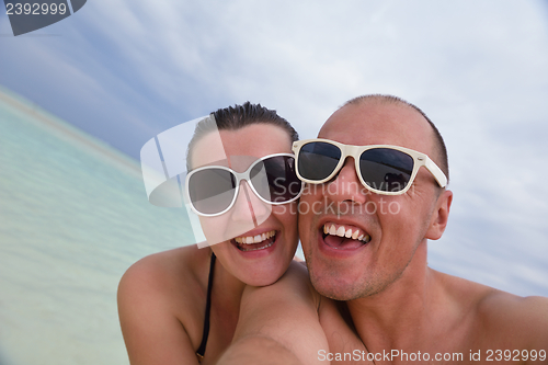 Image of happy young couple have fun on summer