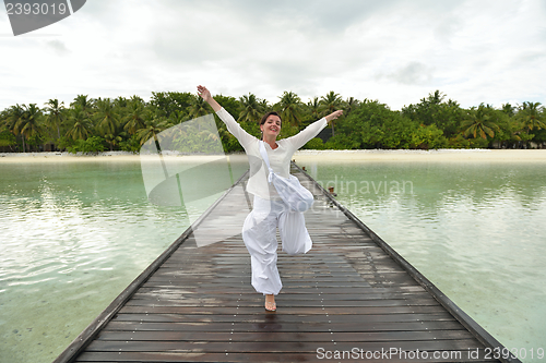 Image of young woman relax on cloudy summer day