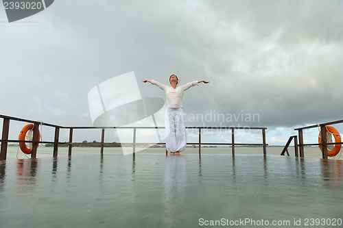 Image of young woman relax on cloudy summer day