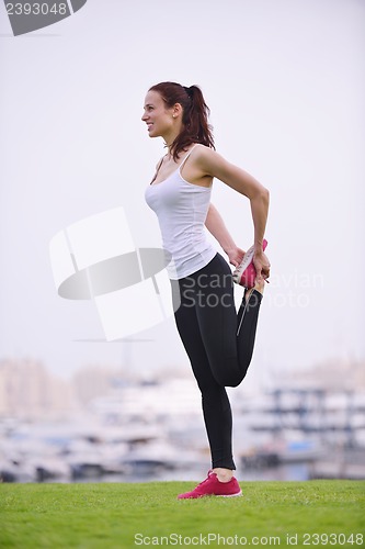Image of Young beautiful  woman jogging  on morning