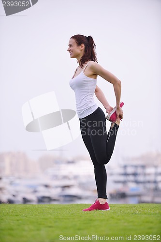 Image of Young beautiful  woman jogging  on morning