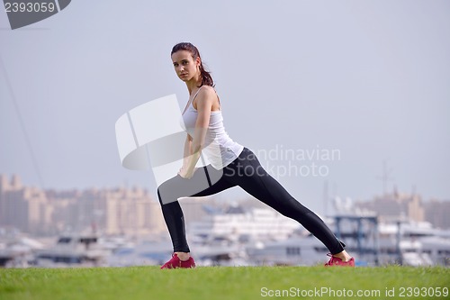 Image of Young beautiful  woman jogging  on morning