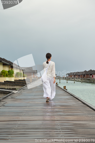 Image of young woman relax on cloudy summer day