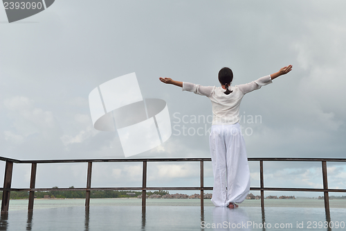 Image of young woman relax on cloudy summer day