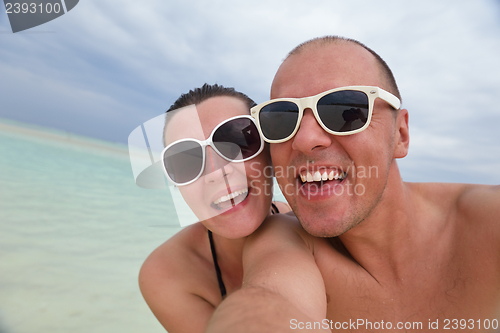 Image of happy young couple have fun on summer