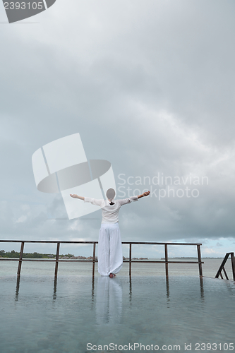 Image of young woman relax on cloudy summer day