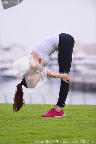 Image of Young beautiful  woman jogging  on morning