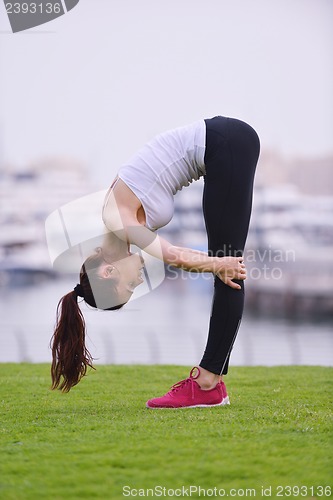 Image of Young beautiful  woman jogging  on morning