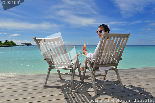 Image of happy young couple relax and take fresh drink