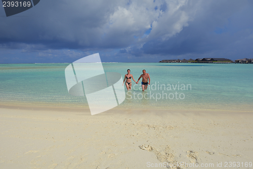 Image of happy young couple have fun on summer