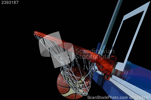 Image of basketball ball and net on black background