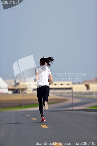 Image of woman jogging at morning