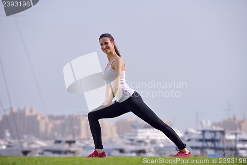 Image of Young beautiful  woman jogging  on morning