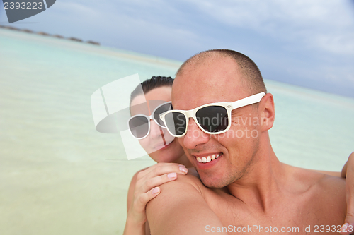 Image of happy young couple have fun on summer