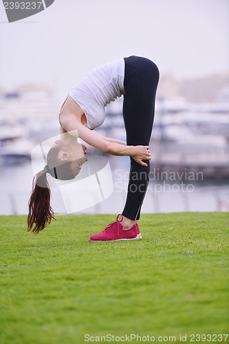 Image of Young beautiful  woman jogging  on morning