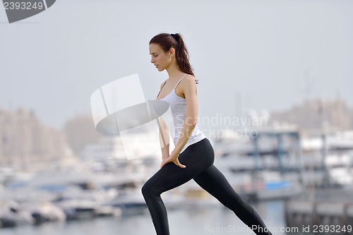 Image of Young beautiful  woman jogging  on morning