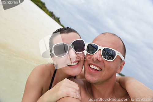 Image of happy young couple have fun on summer