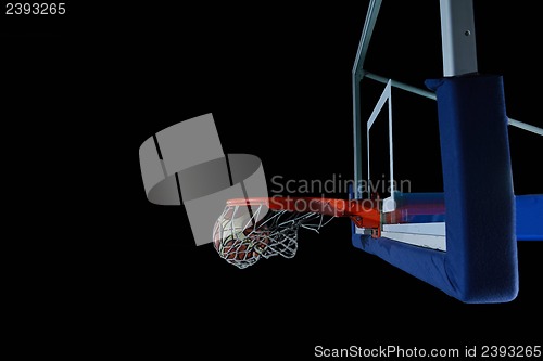 Image of basketball ball and net on black background