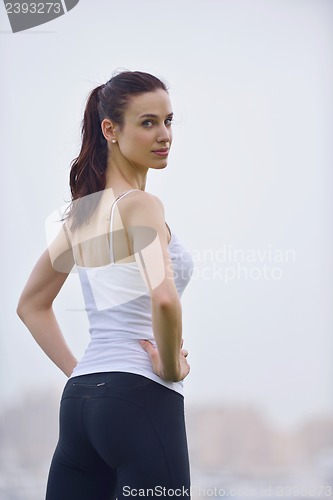 Image of Young beautiful  woman jogging  on morning