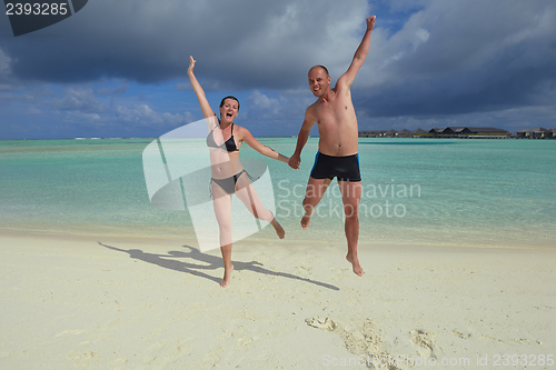 Image of happy young couple have fun on summer